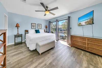 a bedroom with a bed and a ceiling fan at Cassine Gardens 212 in Santa Rosa Beach