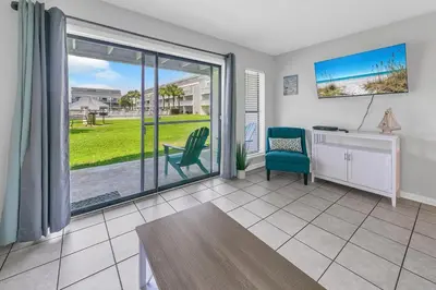 a room with a desk and a chair and a window at Endless Summer B4 in Panama City Beach