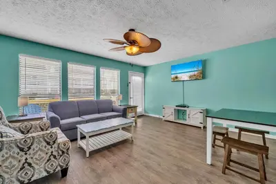 a living room with a couch and a table at Southwind C-3 in Panama City Beach