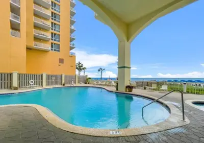 a swimming pool in front of a building at New listing: Gulf/Beach Front Amazing Views in Panama City Beach