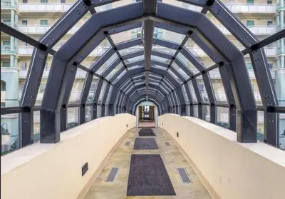 a bridge in a building with a glass ceiling at New listing: Gulf/Beach Front Amazing Views in Panama City Beach