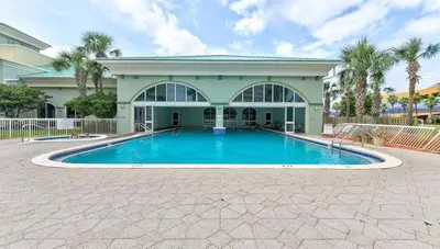 a large swimming pool in front of a house at New listing: Gulf/Beach Front Amazing Views in Panama City Beach