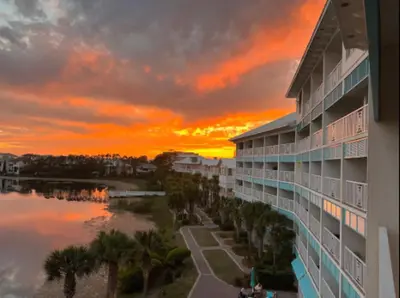 a sunset view from the balcony of a building at New Listing: Water Views, Beach, West end near 30A in Panama City Beach
