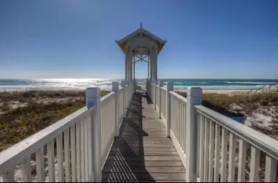 a wooden boardwalk leading to the beach at New Listing: Water Views, Beach, West end near 30A in Panama City Beach