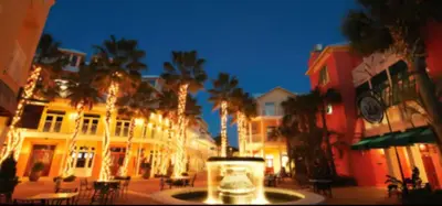 a city street with palm trees and buildings at night at New Listing: Water Views, Beach, West end near 30A in Panama City Beach