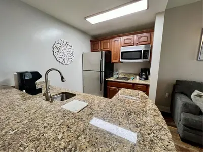 a kitchen with a large counter top in a room at New Listing: Water Views, Beach, West end near 30A in Panama City Beach