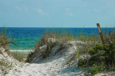 a sandy beach with the ocean in the background at Town of Prominence 67C - Pour Beach Life in Inlet Beach