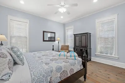 a bedroom with a bed and a ceiling fan at Almost Heaven in Watersound Proper INCLUDES Carriage House! Bedding for 12 in Rosemary Beach