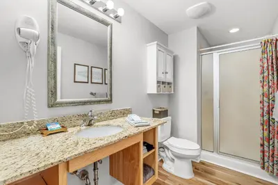 a bathroom with a sink and a toilet at Splash Resort Beachfront in Panama City Beach
