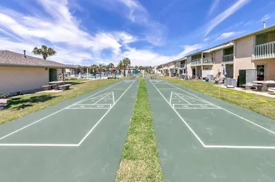 a basketball court in front of a apartment complex at Gulf Highlands 108 in Panama City Beach
