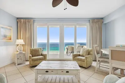 a living room with a view of the ocean at Laketown Wharf #1404 by Nautical Properties in Panama City Beach