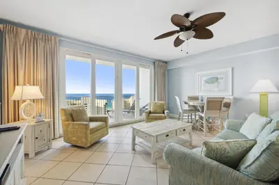 a living room with a couch and chairs and a table at Laketown Wharf #1404 by Nautical Properties in Panama City Beach
