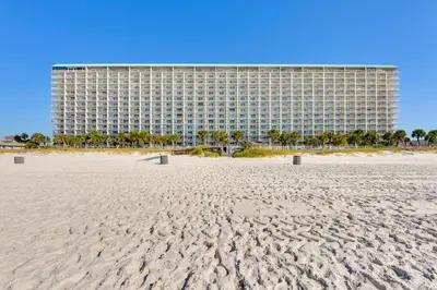 a view of a hotel from the beach at Steps to Shore PCB Condo with Pool Access and Views! in Panama City Beach