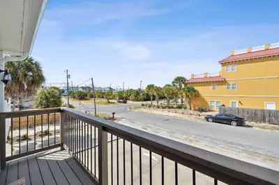 a balcony with a view of a street at La Costeñita in Panama City Beach
