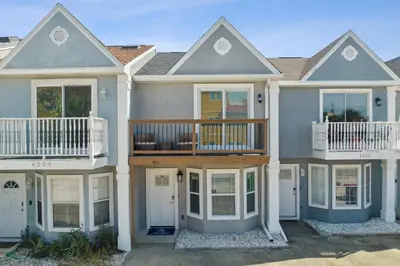 a large house with a balcony on top of it at La Costeñita in Panama City Beach