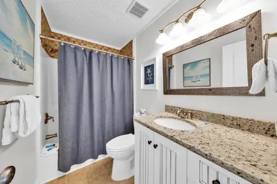 a bathroom with a sink and a toilet at Horizon South 40C- Good Vibes in Panama City Beach