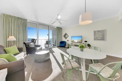 a living room with a table and a couch at Palazzo 404 in Panama City Beach