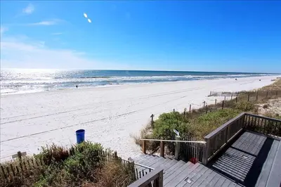 a staircase leading to a beach with the ocean at Palazzo 404 in Panama City Beach