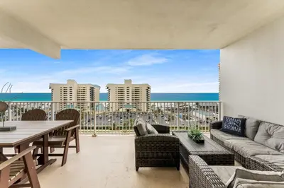 a living room with a view of the ocean at Laketown Wharf #721 by Nautical Properties in Panama City Beach