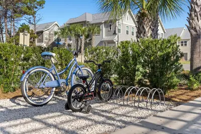 two bikes parked next to each other on a sidewalk at Prominence on 30A Homes by Panhandle Getaways in Watersound Beach