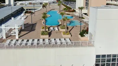 an overhead view of a swimming pool on a building at Laketown Wharf #302 by Nautical Properties in Panama City Beach