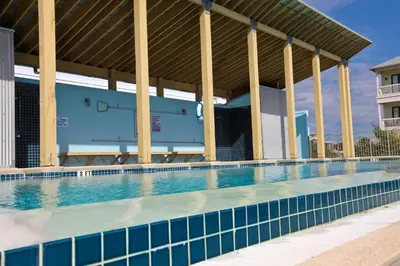a large swimming pool with a large building at Conch Cottage - Lovely 2BR in Seagrove Beach in Santa Rosa Beach