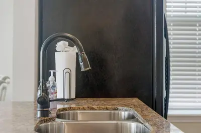 a kitchen sink with a roll of paper towels at Reflections at Bay Point Unit 412 (3/3) in Panama City Beach