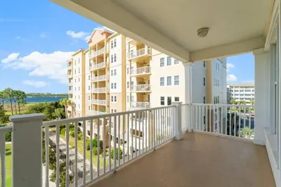 a balcony with a view of a building at Reflections at Bay Point Unit 412 (3/3) in Panama City Beach
