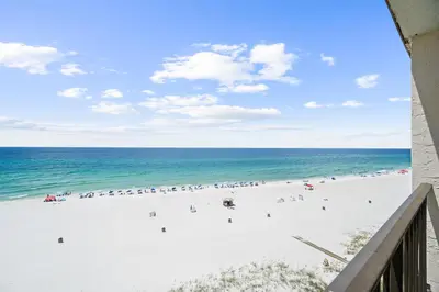 a view of the beach from a balcony at Moondrifter Beach Resort by Panhandle Getaways in Panama City Beach