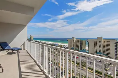 a balcony with a view of the beach and buildings at Laketown Wharf 1226 -2BD+Bunks, Amazing Gulf Views in Panama City Beach