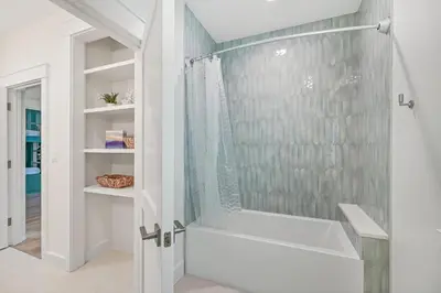 a bathroom with a shower and a bath tub at 30 A-mazing in Santa Rosa Beach