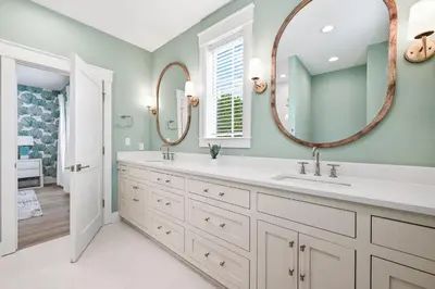 a bathroom with a sink and a mirror at 30 A-mazing in Santa Rosa Beach