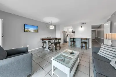 a living room with a couch and a table at The Summit 126 in Panama City Beach