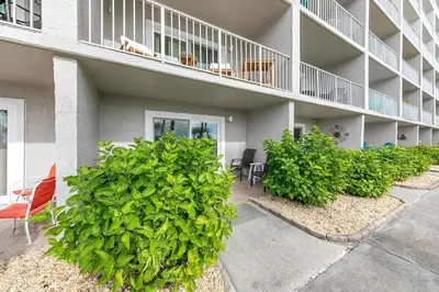 a apartment building with chairs and a balcony at The Summit 126 in Panama City Beach