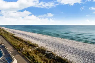an aerial view of a beach with the ocean at Aquavista Condominiums #205-W by Book That Condo in Panama City Beach