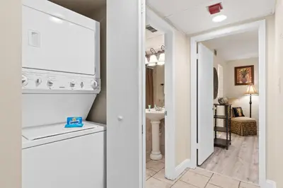 a bathroom with a sink and a mirror at Aquavista Condominiums #204-W by Book That Condo in Panama City Beach