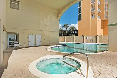 a swimming pool with a hot tub in a building at Celadon 302 in Panama City Beach