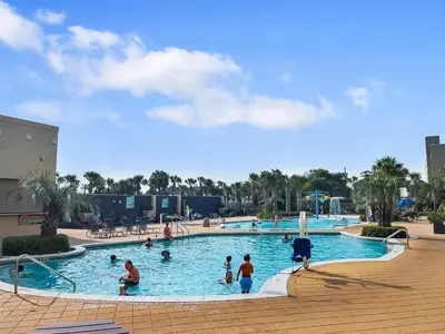 a group of people in a large swimming pool at Emerald Beach Resort 2235 in Panama City Beach