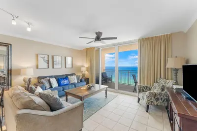 a living room with a couch and a table at Emerald Beach Resort 2235 in Panama City Beach