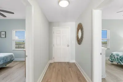 a bedroom with white walls and a white door at Laketown Wharf #1612 by Nautical Properties in Panama City Beach