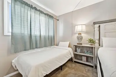 a bedroom with two beds and a window at The Summit 725 in Panama City Beach