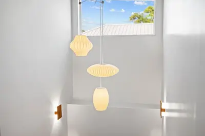 a room with two hanging lights and a window at NEW Listing! 4 BR/ 3.5 BA, SLEEPS 10, HEATED SALT WATER POOL in Seagrove Beach