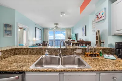 a kitchen with a sink and a counter top at Once Upon A Tide in Panama City Beach