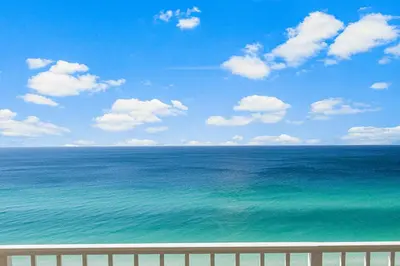 a view of the ocean from a balcony at Spectacular 3BD Beachfront Condo! Spacious! by Dolce Vita Getaways PCB in Panama City Beach