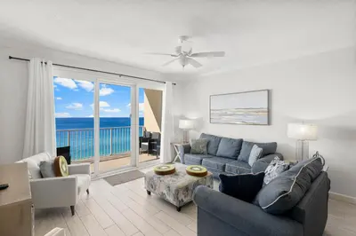 a living room with a couch and chairs and a window at Spectacular 3BD Beachfront Condo! Spacious! by Dolce Vita Getaways PCB in Panama City Beach