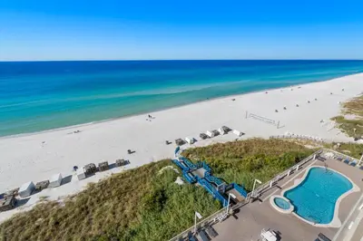 an aerial view of a beach and a pool at Seychelles #703 by Nautical Properties in Panama City Beach