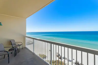 a balcony with a view of the ocean at Seychelles #703 by Nautical Properties in Panama City Beach