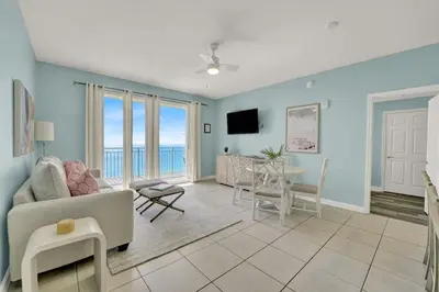 a living room with a couch and a table at Sterling Reef 1802B in Panama City Beach