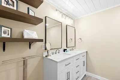 a bathroom with a sink and two mirrors at 3BR, 3BA beachfront townhome! Sleeps 11! Ocean view! Steps to the beach! in Panama City Beach