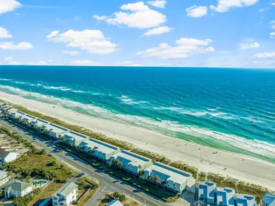 an aerial view of the beach and the ocean at 3BR, 3BA beachfront townhome! Sleeps 11! Ocean view! Steps to the beach! in Panama City Beach